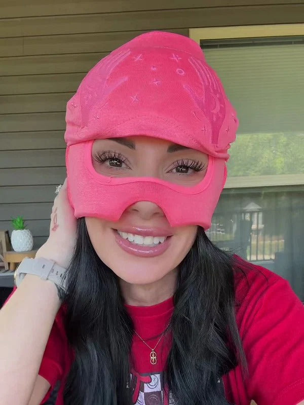 Woman wearing the blush pink migraine relief cap